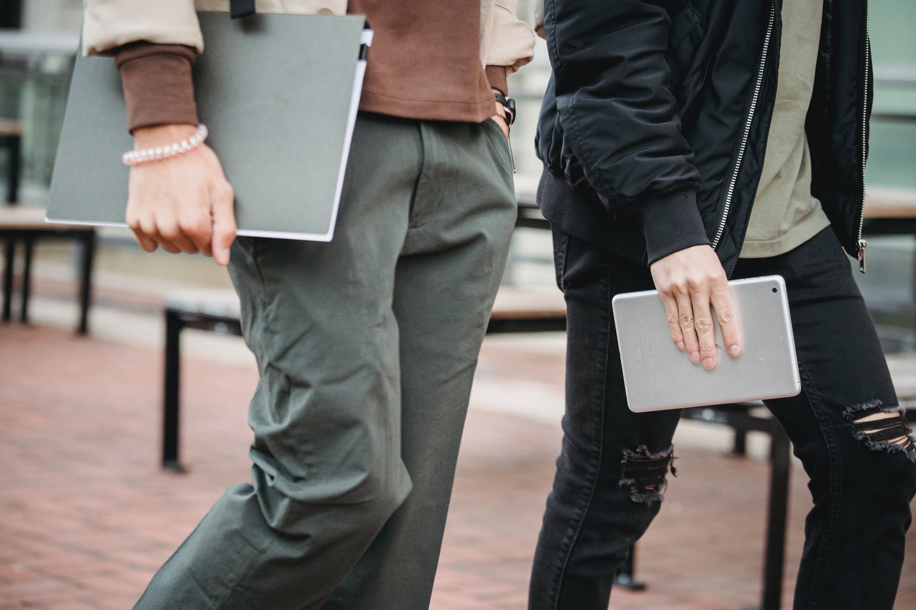 crop men with tablet and folder